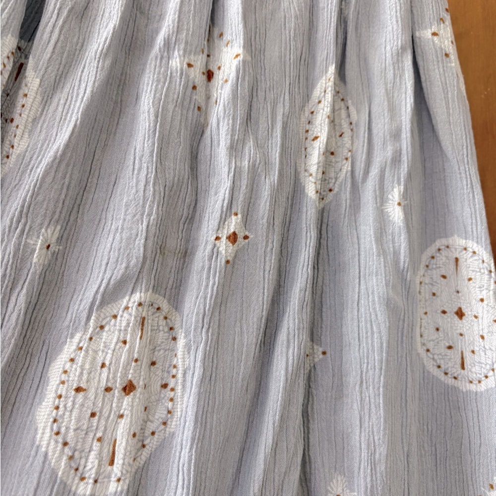 Lace-edged light blue printed summer top